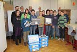 Optima supports robotics clubs at three schools in Schwaebisch Hall. In picture: Hans Bühler (Owner of Optima, last row, right), Dieter Käßmann (School director, second from right), pupils and advisors.