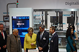 Hannover Messe 2015: German Chancellor Angela Merkel received a personalized perfume called Angela's Dream from Siemens executive Joe Kaeser, made with an Optima machine.